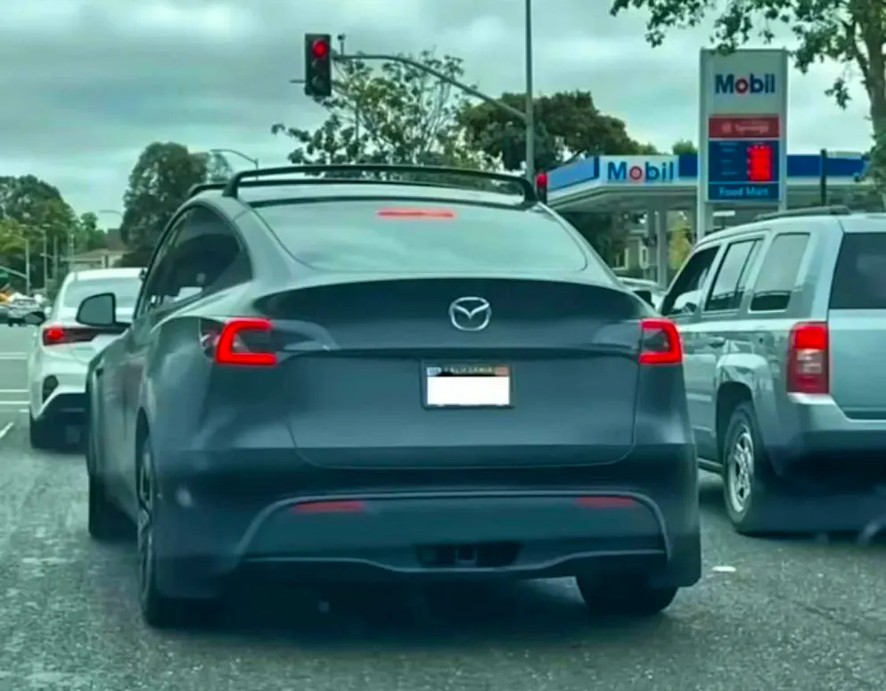 Tesla owners camouflage their cars. Another "Mazda".