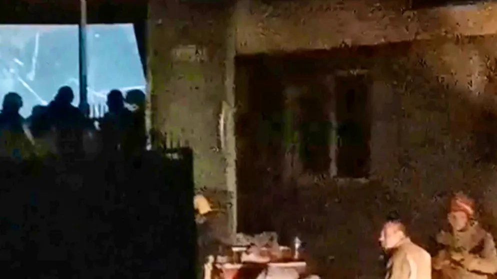 dpatopbilder - SCREENSHOT - Rescue workers at the scene of the fire. Photo: Kocani TV/Kocani TV/AP/dpa