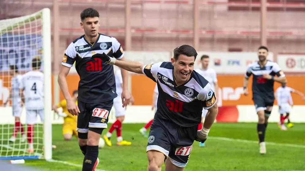 Double goal scorer Georgios Koutsias celebrates