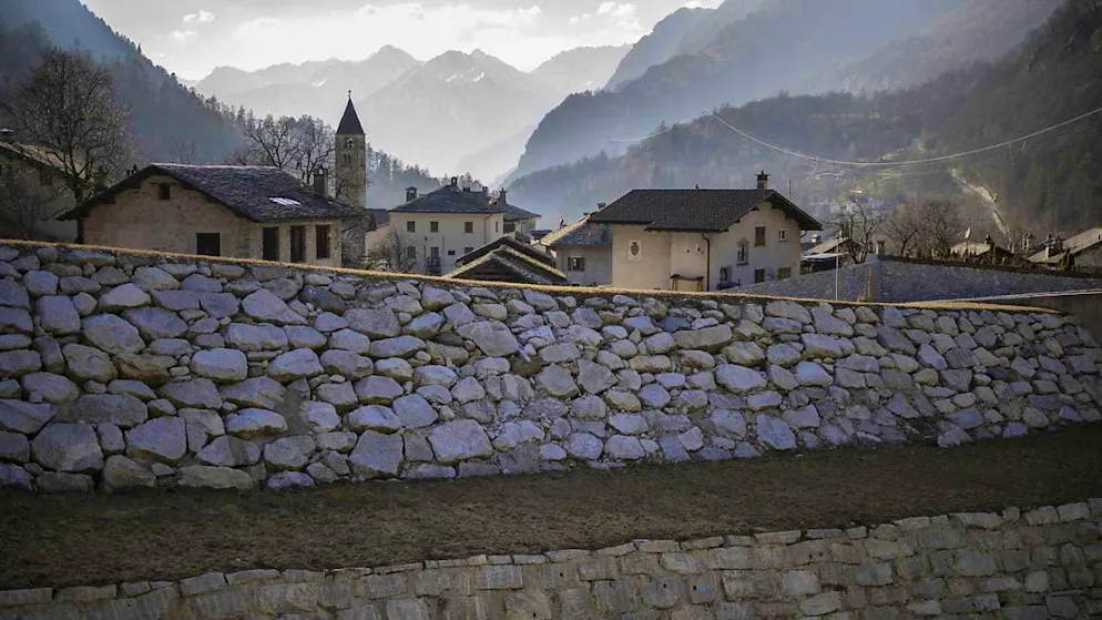 Bondo returns to normality with new protective structures - Gallery. An enlarged debris basin protects Bondo from renewed mudslides.