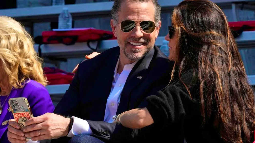 ARCHIVE - Robert Hunter Biden (l), son of US President Biden, talks with his sister Ashley Biden, during his daughter's graduation ceremony at the University of Pennsylvania. Photo: Patrick Semansky/AP/dpa