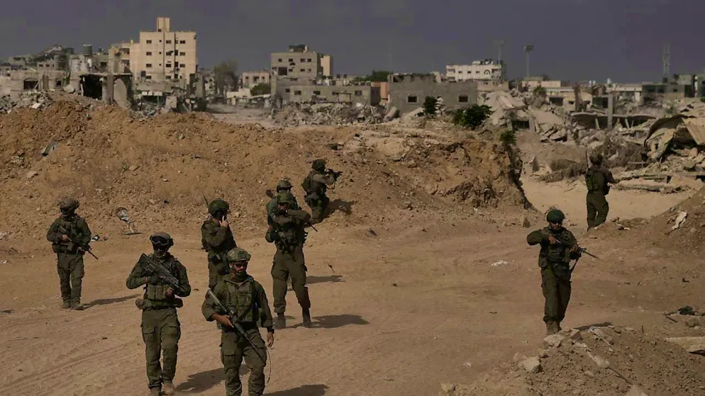 ARCHIVE - Israeli soldiers take up positions during a ground operation in the southern Gaza Strip. (PHOTO TAKEN UNDER IDF SUPERVISION AND REVIEWED BY MILITARY CENSORS) Photo: Leo Correa/AP/dpa
