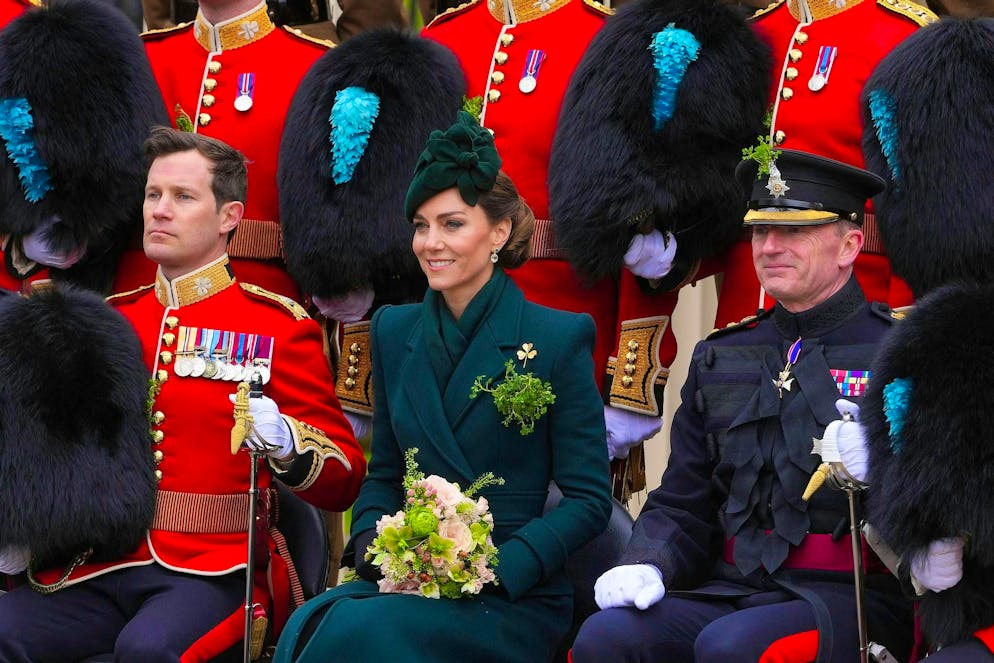 Princess Kate celebrates St. Patrick's Day in London - Gallery. Kate wore a green outfit with a gold shamrock pin to match the occasion.