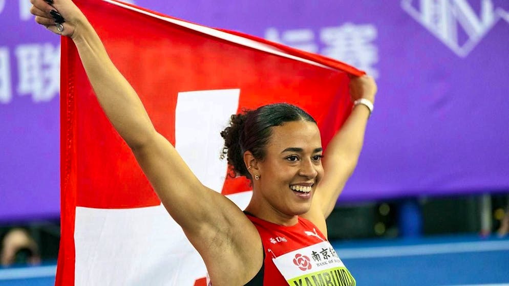 Ditaji Kambundji celebrates after her hurdles sprint, which is rewarded with a silver medal