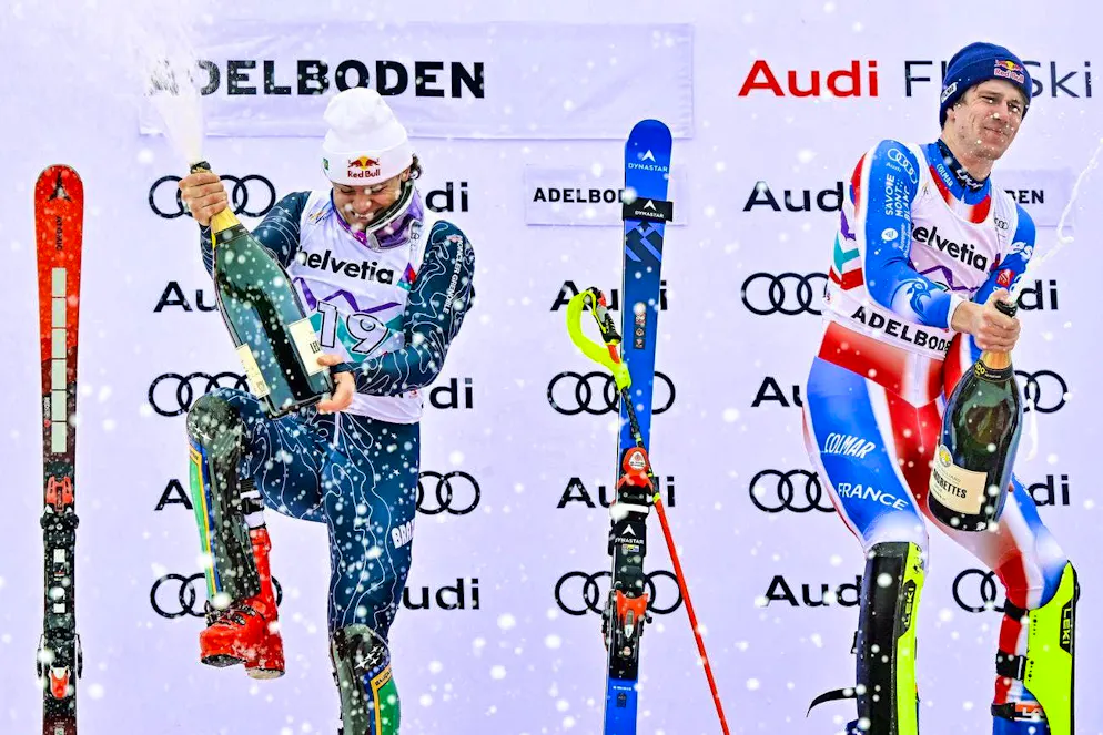 Lucas Pinheiro Braathen (left), competing for Brazil, pops the corks after his third place in Adelboden - winner Clément Noël does the same.