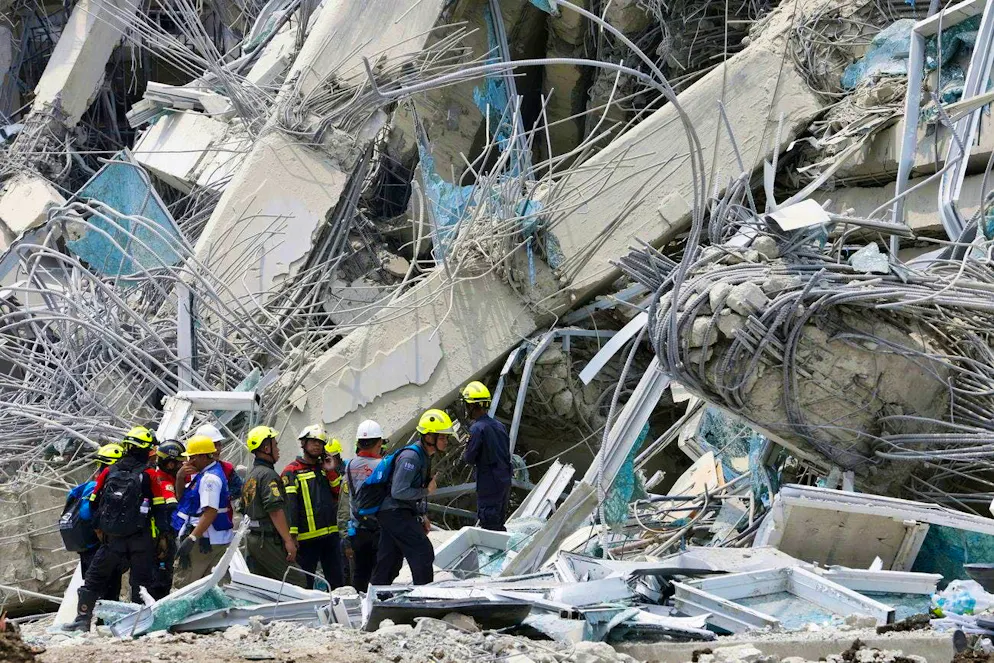 Rescuers search for missing people: This picture of the destroyed high-rise building in Bangkok was taken today.