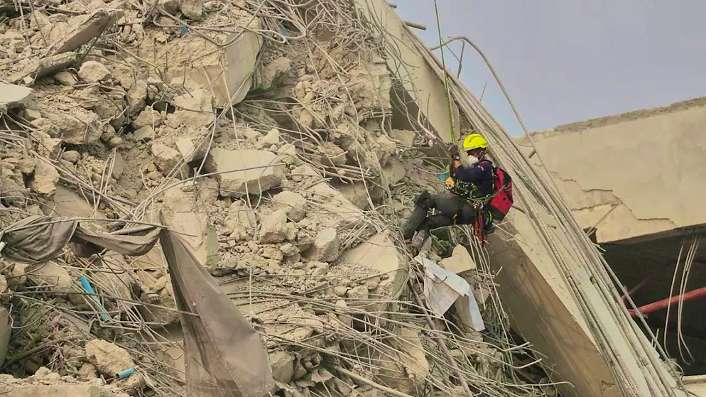 Rescue workers work at the site of a high-rise building that collapsed after an earthquake in Bangkok, Thailand, on Friday. Photo: Sakchai Lalit/AP/dpa