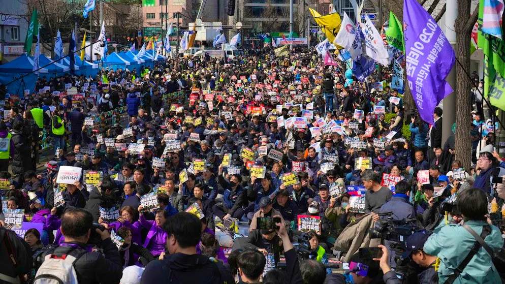 Demonstrators demand the impeachment of South Korean President Yoon Suk Yeol during a protest in Seoul on Friday - the court's decision came shortly afterwards.