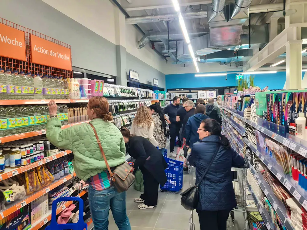 Action opening Bachenbülach. There is heavy traffic in the aisles between the shelves.