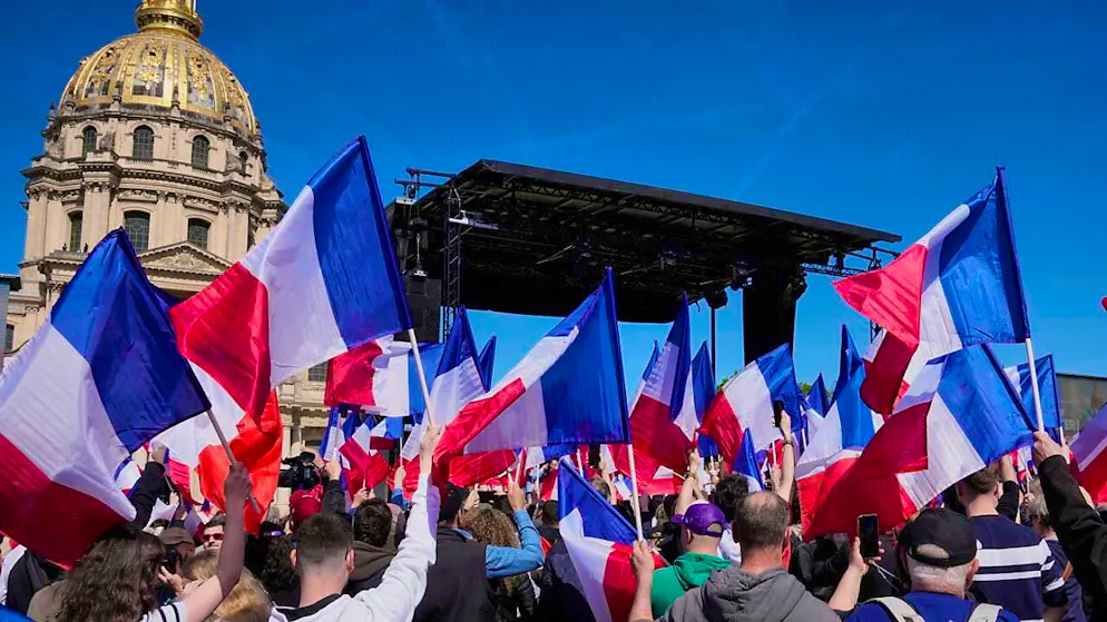 People take part in the rally of the right-wing party Rassemblement National (RN) near the parliament following the exclusion of right-wing populist Marine Le Pen from elections by a court. Photo: Michel Euler/AP/dpa