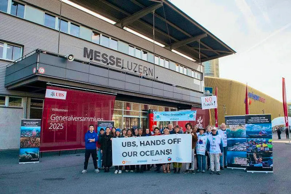 Climate activists protest outside the Lucerne Exhibition Center. 