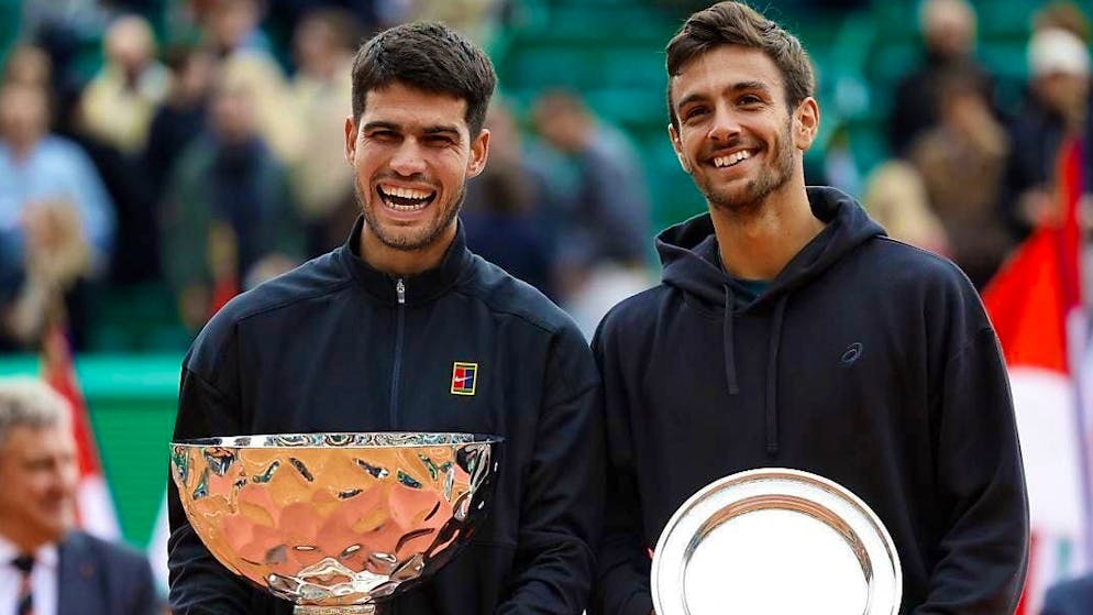 Carlos Alcaraz (left) a beaming winner in Monte Carlo after the final against Lorenzo Musetti.