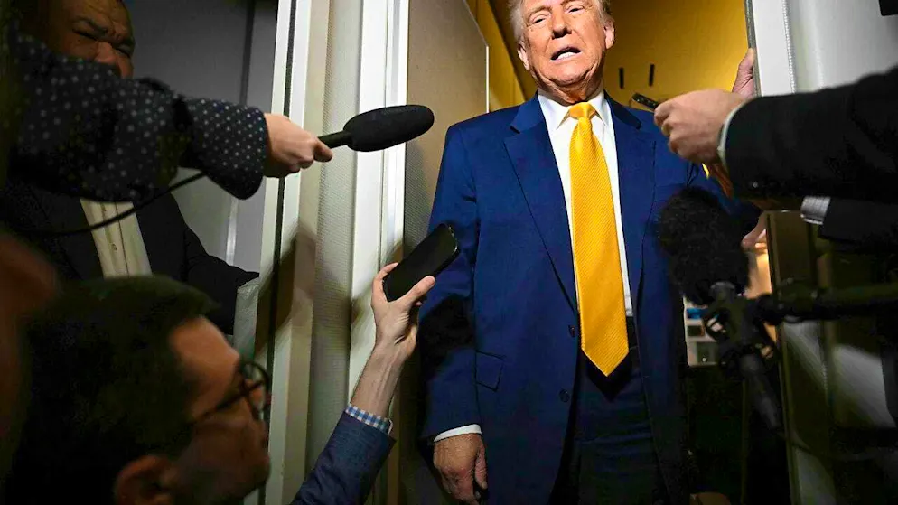 US President Donald Trump speaks to reporters on board Air Force One. Photo: -/Pool via AP/dpa/Archive image