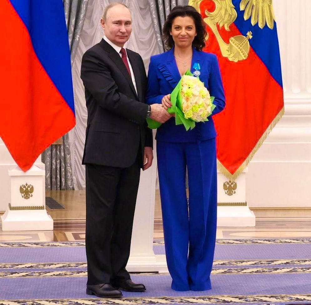 Vladimir Putin presents Margarita Simonyan with the Order of Honor in the Kremlin on 20 December 2022.