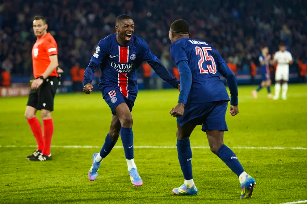 Nuno Mendes (right) celebrates with Ousmane Dembélé.