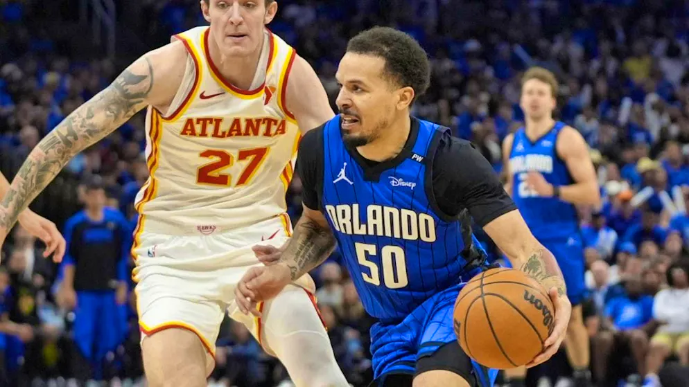 Cole Anthony of the Orlando Magic prevails against Vit Krejci of the Atlanta Hawks
