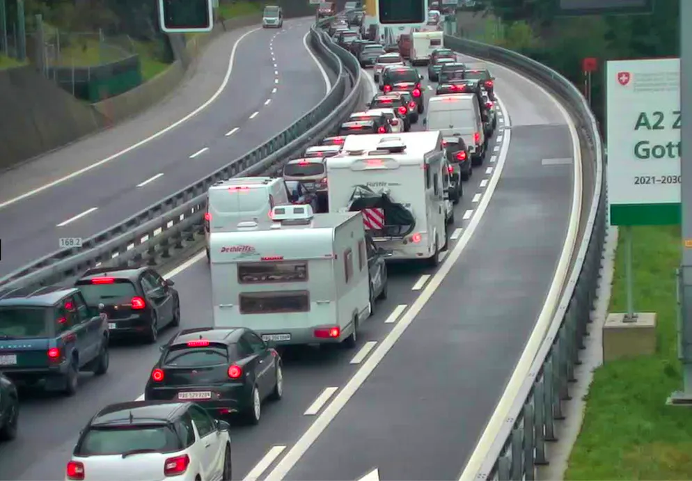 Year after year, columns of cars pile up in front of the Gotthard road tunnel.