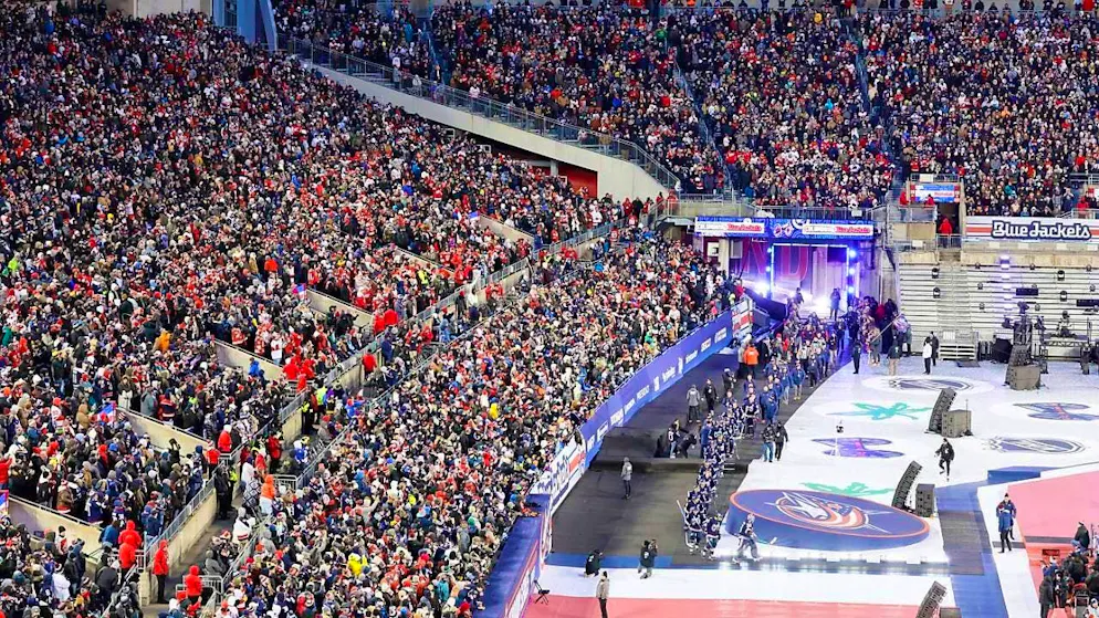 The outdoor game at Ohio Stadium between Columbus and Detroit contributed to the new record with 94,751 spectators.
