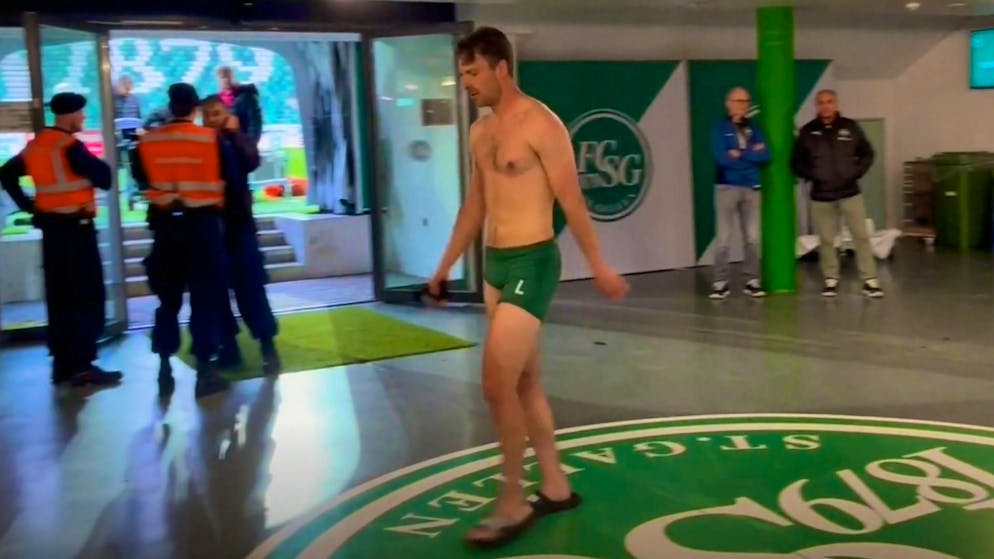 Dressed only in his underpants, Lukas Görtler marches into the referee's booth.