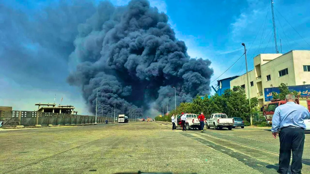 HANDOUT - In this photo provided by Tasnim news agency via AP, black smoke rises into the sky after a powerful explosion rocked a port near the southern port city of Bandar Abbas. Hundreds of people were injured. Photo: Meysam Mirzadeh/Tasnim News Agency/AP/dpa - ATTENTION: For editorial use only in connection with current reporting and only with full attribution to the above credit
