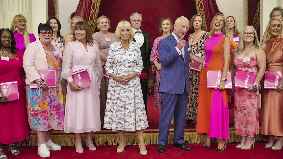 King Charles III and Queen Camilla with members of the Change and Check choir at Buckingham Palace at a reception for community initiatives in the fight against cancer. (April 30, 2025)