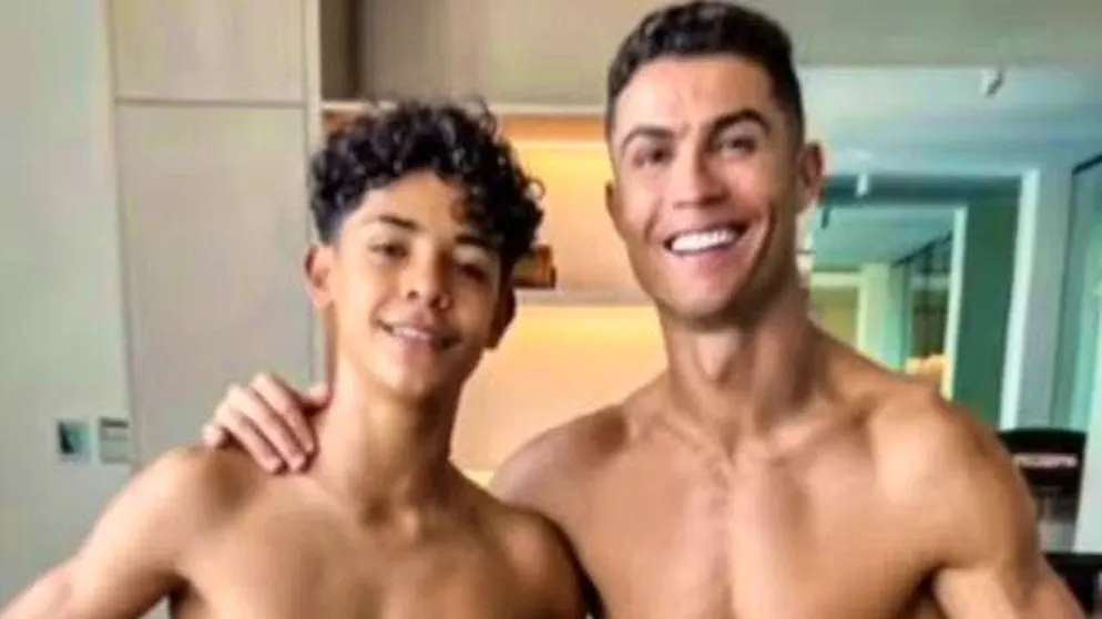 Ronaldo and his son show off their muscles.