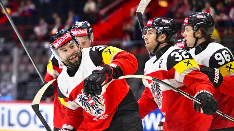 Peter Schneider (left) celebrates after the decisive penalty