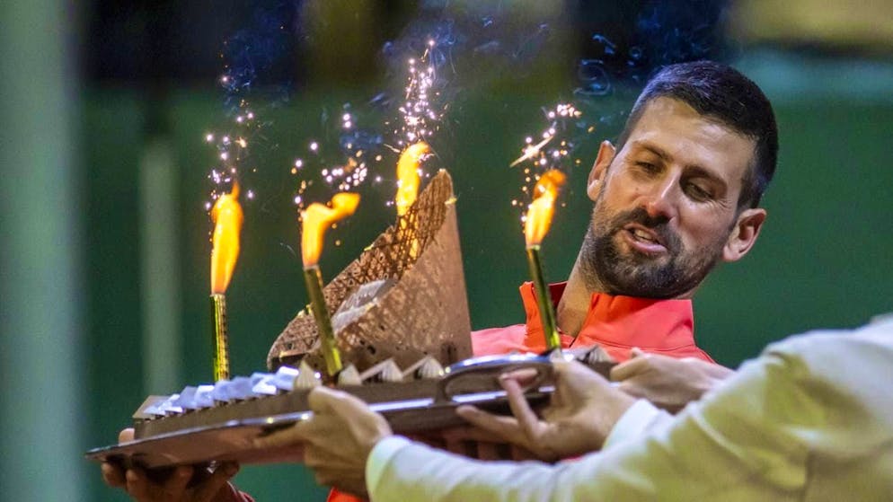 Novak Djokovic was presented with a cake by the organizers of the Geneva Open on his 38th birthday