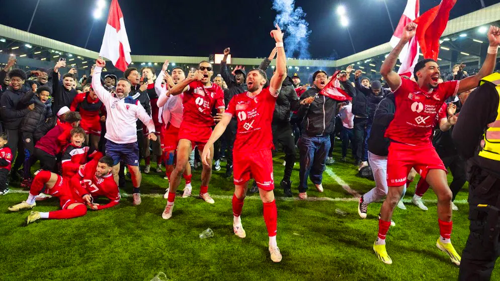 Damian Kelvin (right) and his team-mates celebrate with the fans after winning the Cup semi-final against Young Boys.