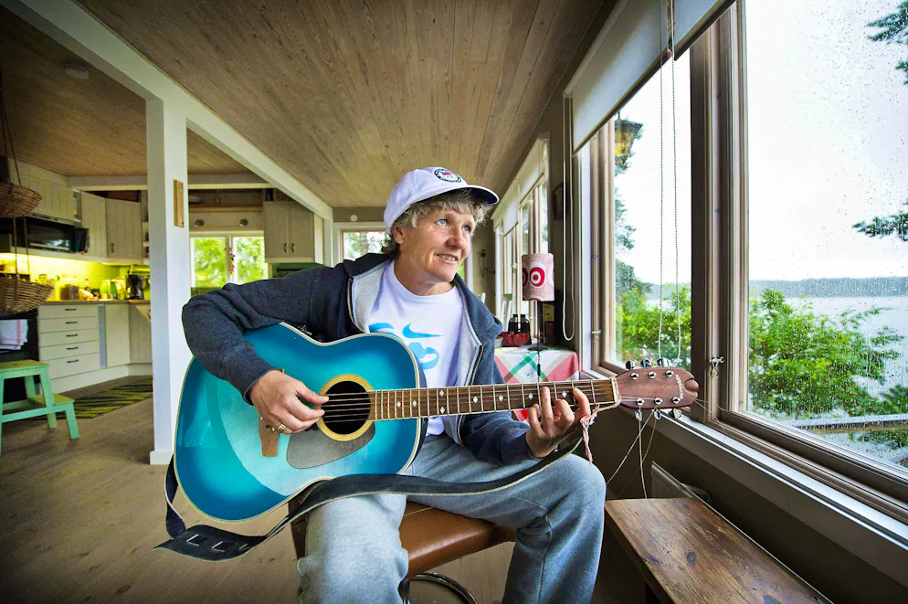 Snapshots from Pia Sundhage's great career. <strong>2012:</strong> Pia Sundhage plays the guitar in her summer house in Sweden. An important retreat for her to this day: "I need these moments when I'm not in competition mode."
