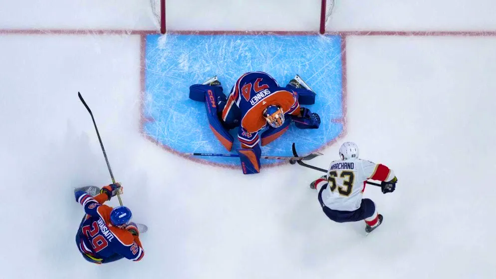 The late decision in Edmonton: Brad Marchand (number 63) beats Edmonton goalie Stuart Skinner in the second overtime to score the winning goal
