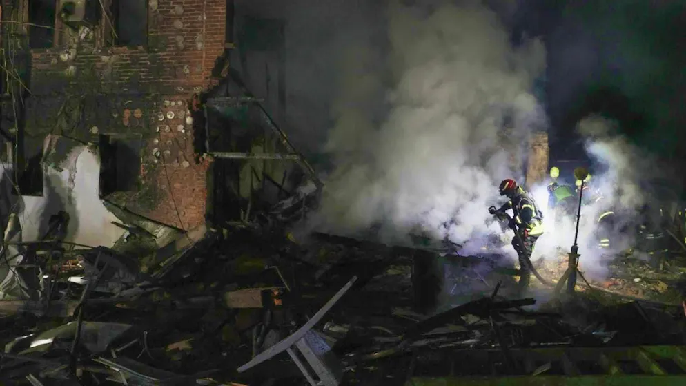 ARCHIVE - Rescue workers extinguish a fire in a residential building in Kharkiv. Photo: Viacheslav Madiievskyi/Ukrinform/dpa