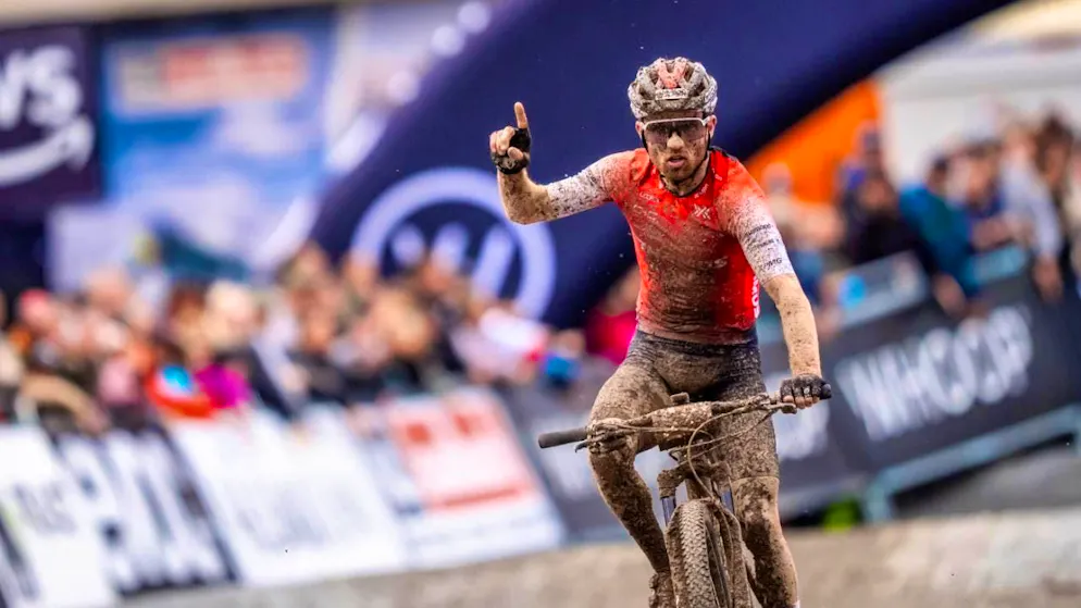 A mud-smeared Mathias Flückiger returns to the podium in Leogang