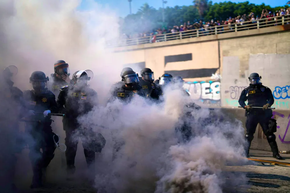 Protests L.A.. The police drove demonstrators off a freeway that runs through the city center.