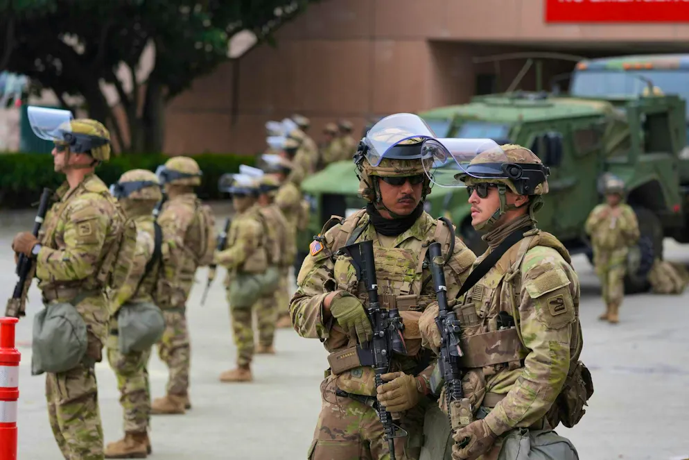 Protests L.A.. National Guard soldiers marched in front of a federal prison in Los Angeles.
