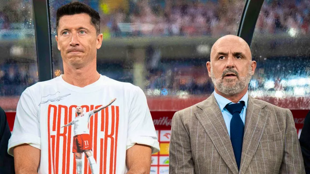 The tablecloth between Robert Lewandowski (left) and national team coach Michal Probierz appears to have been cut in two.