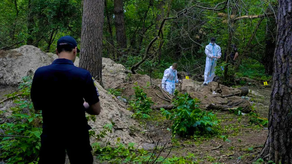Just a "pretext": exhumation at a mass grave near Butsha on June 13, 2022.