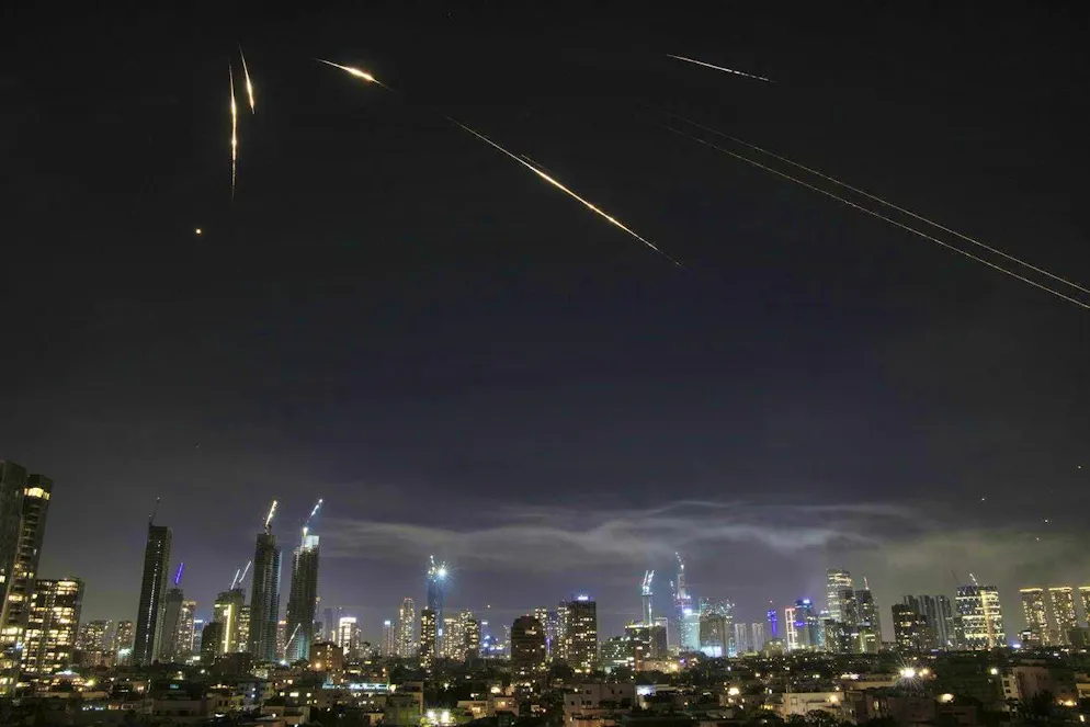 The Israeli Iron Dome air defense system fights Iranian missiles in Tel Aviv.