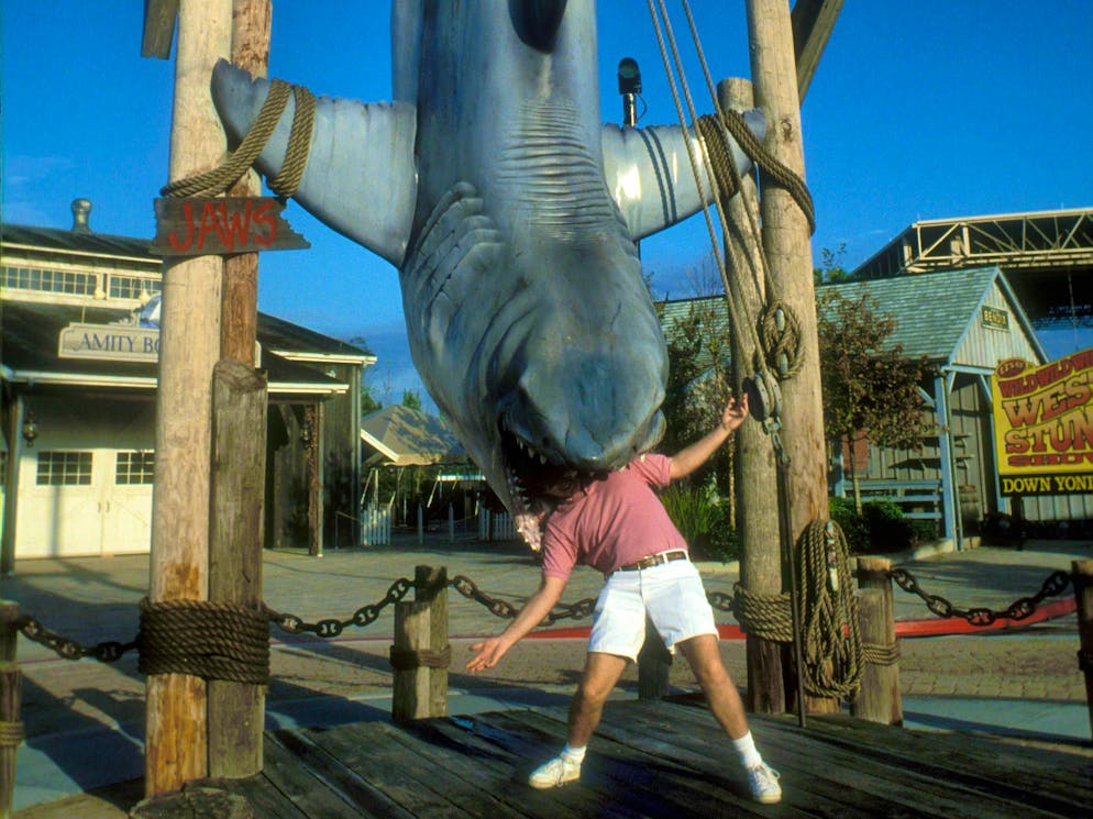 Classic of film history: Man in the mouth of a suspended shark dummy from the film "Jaws" at Universal Studios Florida in Orlando