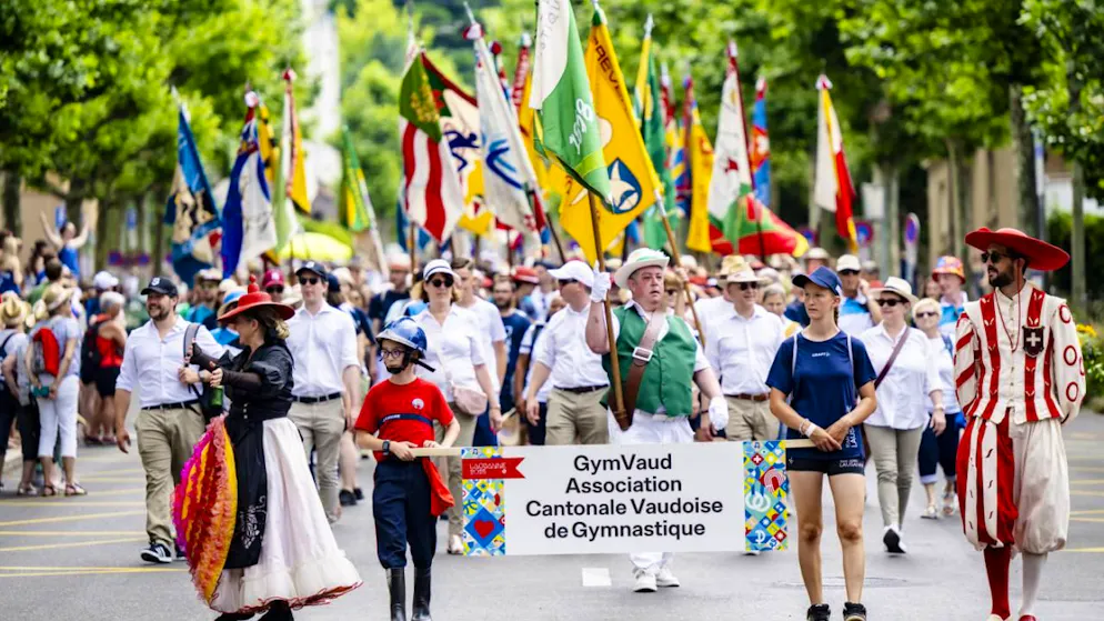 Fête fédérale de gymnastique: cortège et flonflons à Lausanne - Gallery. Les associations cantonales de gymnastique ont pris part au cortège samedi à Lausanne.