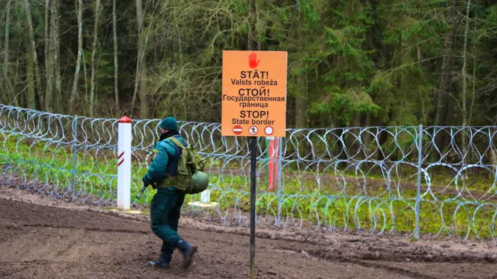 ARCHIVE - "Stop - state border" is written in three languages on the border with Belarus. Photo: Alexander Welscher/dpa