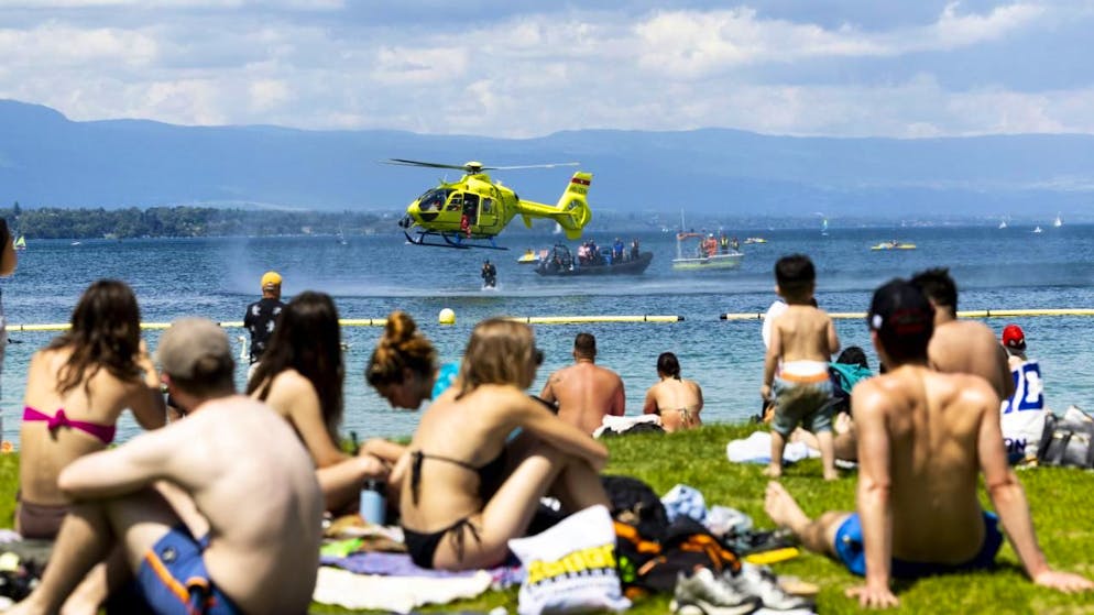 A lake police diver jumps into the water from a regau's helicopter to rescue a drowning victim during a prevention action organized on June 5 by the Geneva police. accident: more than 50 drownings