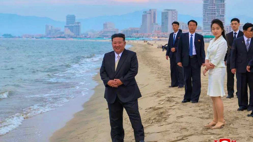 HANDOUT - This photo provided by North Korea's state news agency KCNA shows North Korean strongman Kim Jong Un (M) together with his daughter Kim Ju Ae on Wonsan beach at the opening of the Wonsan-Kalma tourist resort. Photo: ---/KCNA via YNA/dpa - ATTENTION: For editorial use only in connection with current reporting and only with full attribution of the above credit