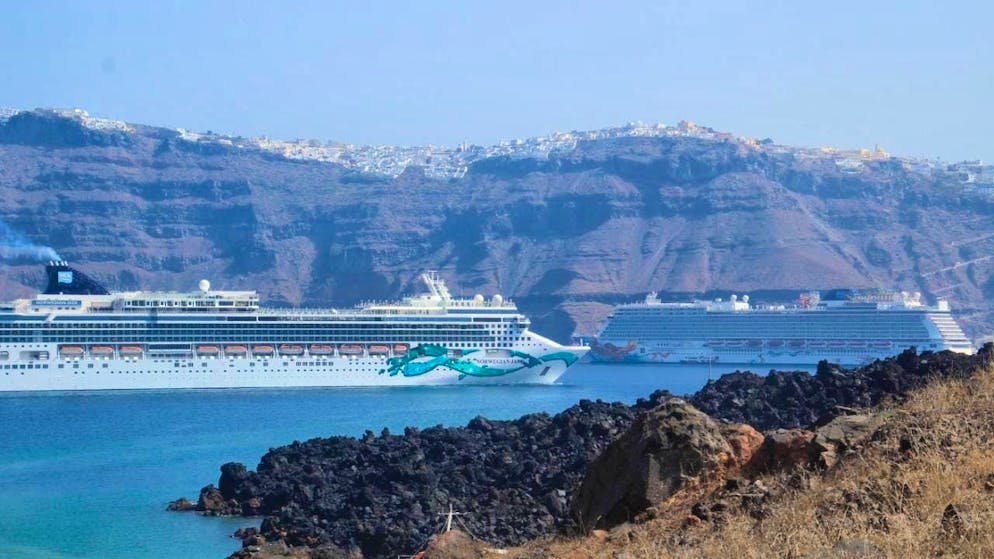 ARCHIVE - Cruise ships off Santorini: Greece is taking action against mass cruise tourism on popular islands. Photo: Cindy Riechau/dpa