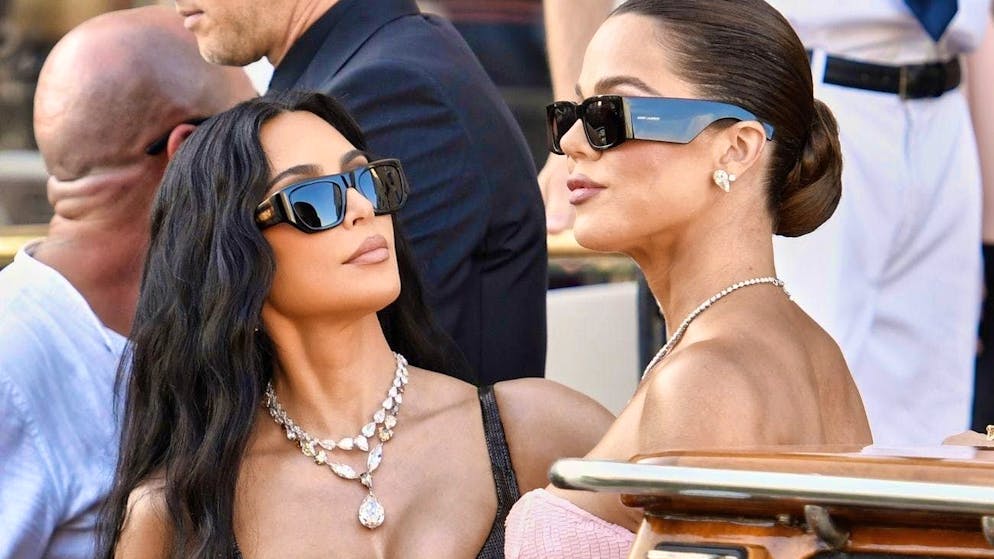 Khloé Kardashian (right) with sister Kim at Jeff Bezos and Lauren Sánchez's wedding in Venice at the end of June.