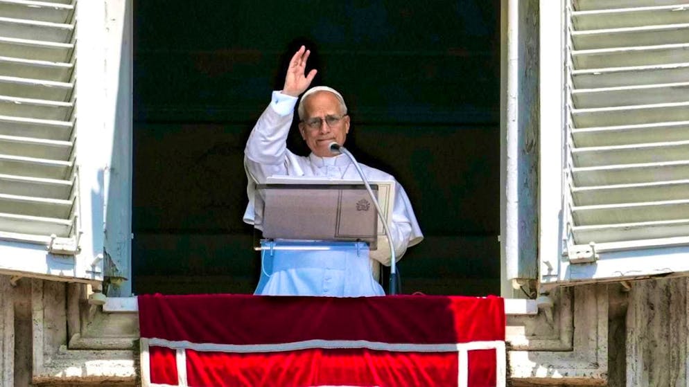 Pope Leo XIV appears at the window of his studio. Photo: Andrew Medichini/AP/dpa