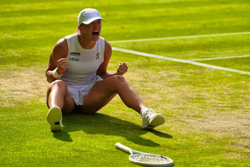 6:0, 6:0: Swiatek makes tennis history with Wimbledon title - Gallery. Iga Swiatek celebrates her title.