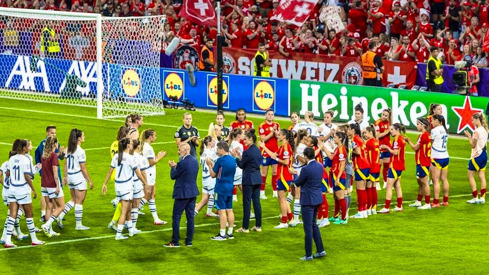 The Spanish women stand guard for the Swiss after the game.