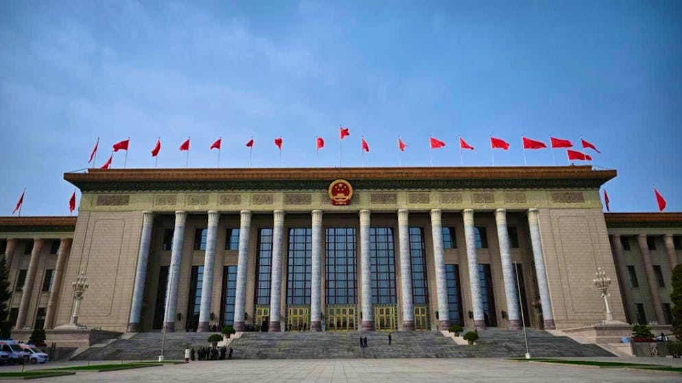 ARCHIVE - Red flags fly at the Great Hall of the People in Beijing (archive photo). Photo: Johannes Neudecker/dpa