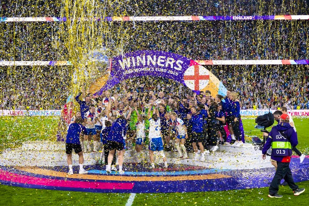 England celebrate with the trophy.